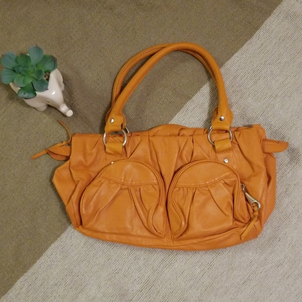 Orange Daisy Fuentes handbag with pockets